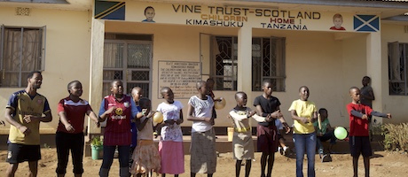 People singing outside Kimashuku children's home, Tanzania